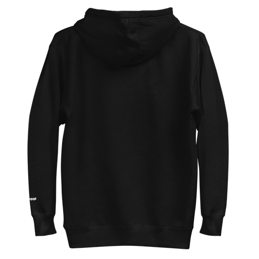 A plain black hooded sweatshirt shown from the back, with a small white text detail on the lower right sleeve near the cuff. The detail reads "skoggl".
