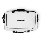 White gym duffel bag with black handles and straps on a white background, featuring the 'skoggl' brand.