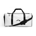 White gym duffel bag with black straps and a skoggl mountain logo on a white background