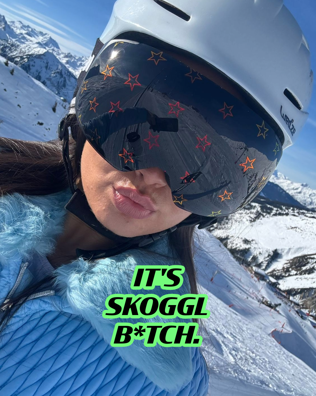 Person on a snowy mountain wearing Skoggl goggles with a star pattern. Text at the bottom of the image reads: ‘It’s Skoggl, bitch.