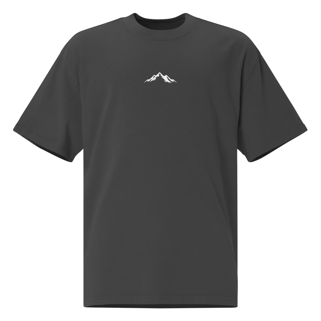 Faded black Skoggl t-shirt with white mountain design and logo centered on chest