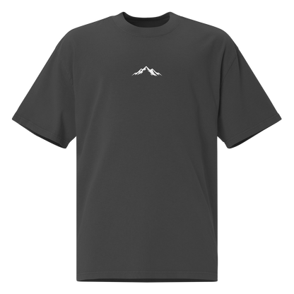 Faded black Skoggl t-shirt with white mountain design and logo centered on chest