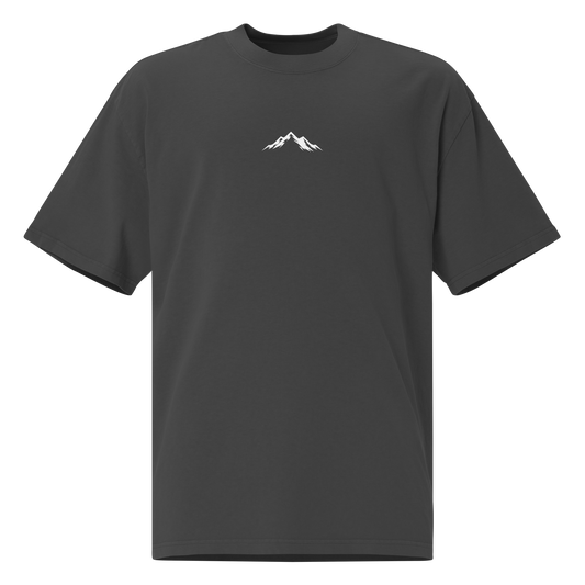 Faded black Skoggl t-shirt with white mountain design and logo centered on chest