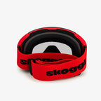Red ski goggles with a wide red strap featuring the word 'Skoggl', shown from the back. Clear lenses are visible through the frame, paired with black cushioning for comfort and a secure fit. Perfect for customizable, stylish ski and snowboard gear designed for performance on the slopes.
