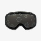Close-up of the Snowflake Lens, a magnetic ski and snowboard goggle lens featuring intricate snowflake designs. Showcases the easy-swap magnetic feature, elegant patterns, and high-performance clarity for style and adaptability in all winter conditions. Perfect for pairing with Skoggl frames.