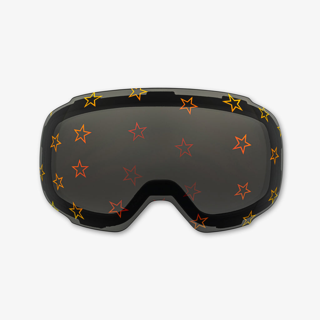 Close-up of the Starstruck Lens, a magnetic ski and snowboard goggle lens featuring bold star designs. Highlights the easy-swap magnetic feature, vibrant patterns, and high-performance clarity for style and adaptability on the slopes. Perfect for pairing with Skoggl frames.