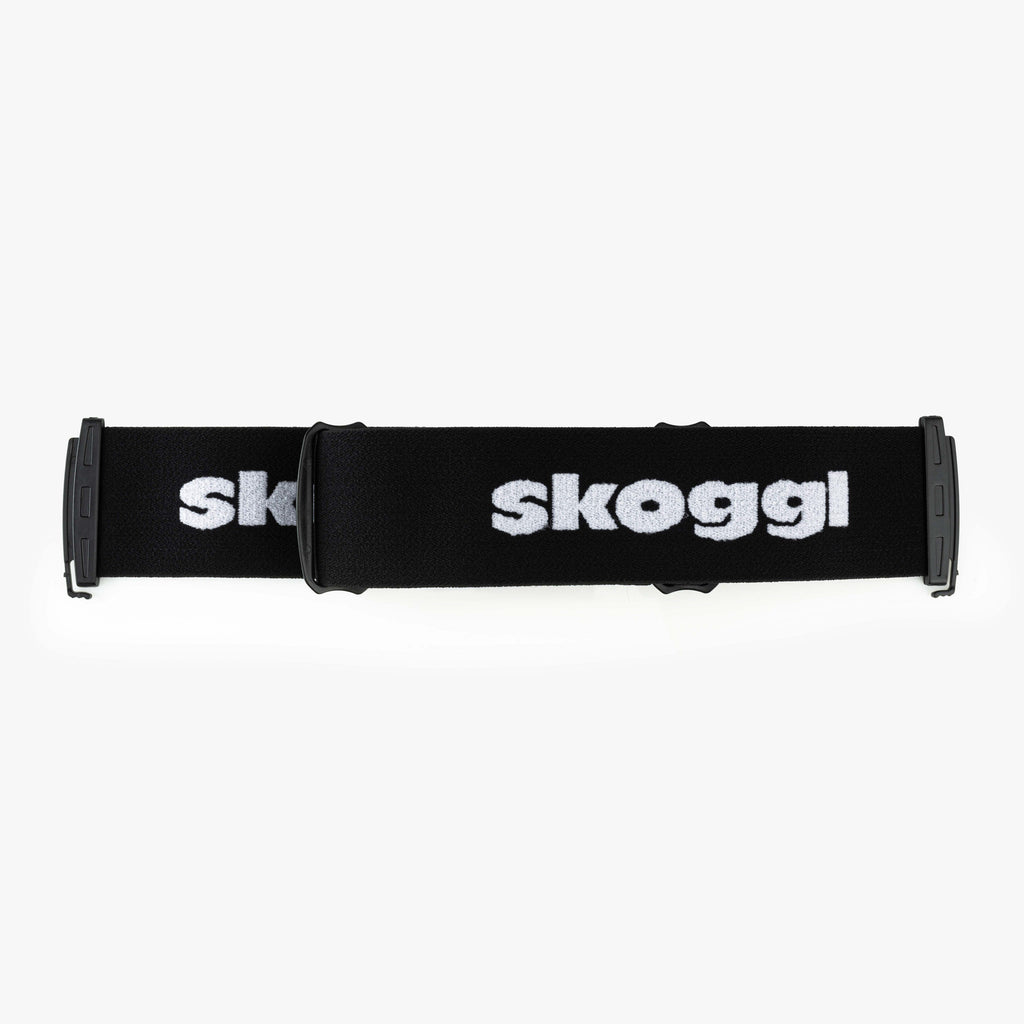 A bold black strap designed for ski and snowboard goggles, featuring durable material and easy attachment for a secure, customizable fit. Perfect for pairing with Skoggl frames to add a pop of color and style to your winter sports gear.