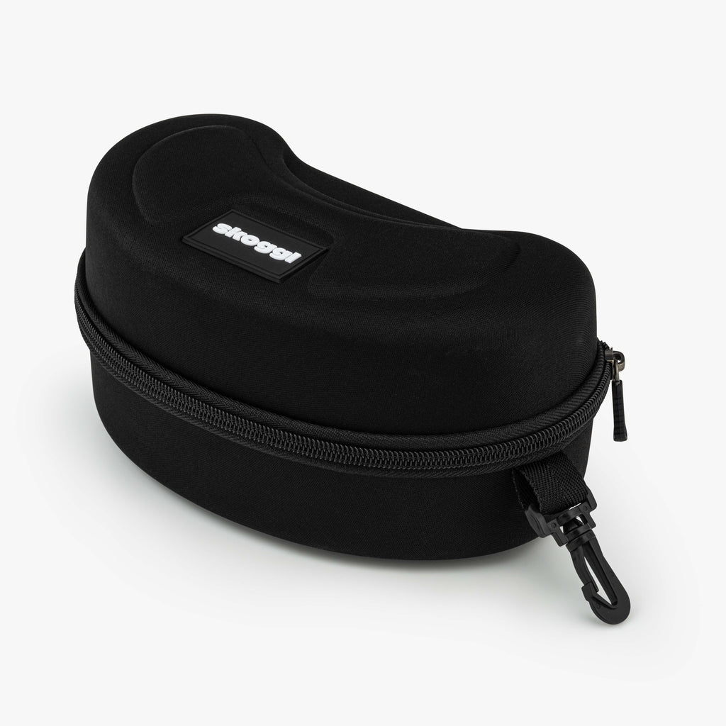 A black, hard, ski goggle case with a zipper and a small hook for attachment. The case has a textured exterior and a logo reading 'Skoggl' on top.