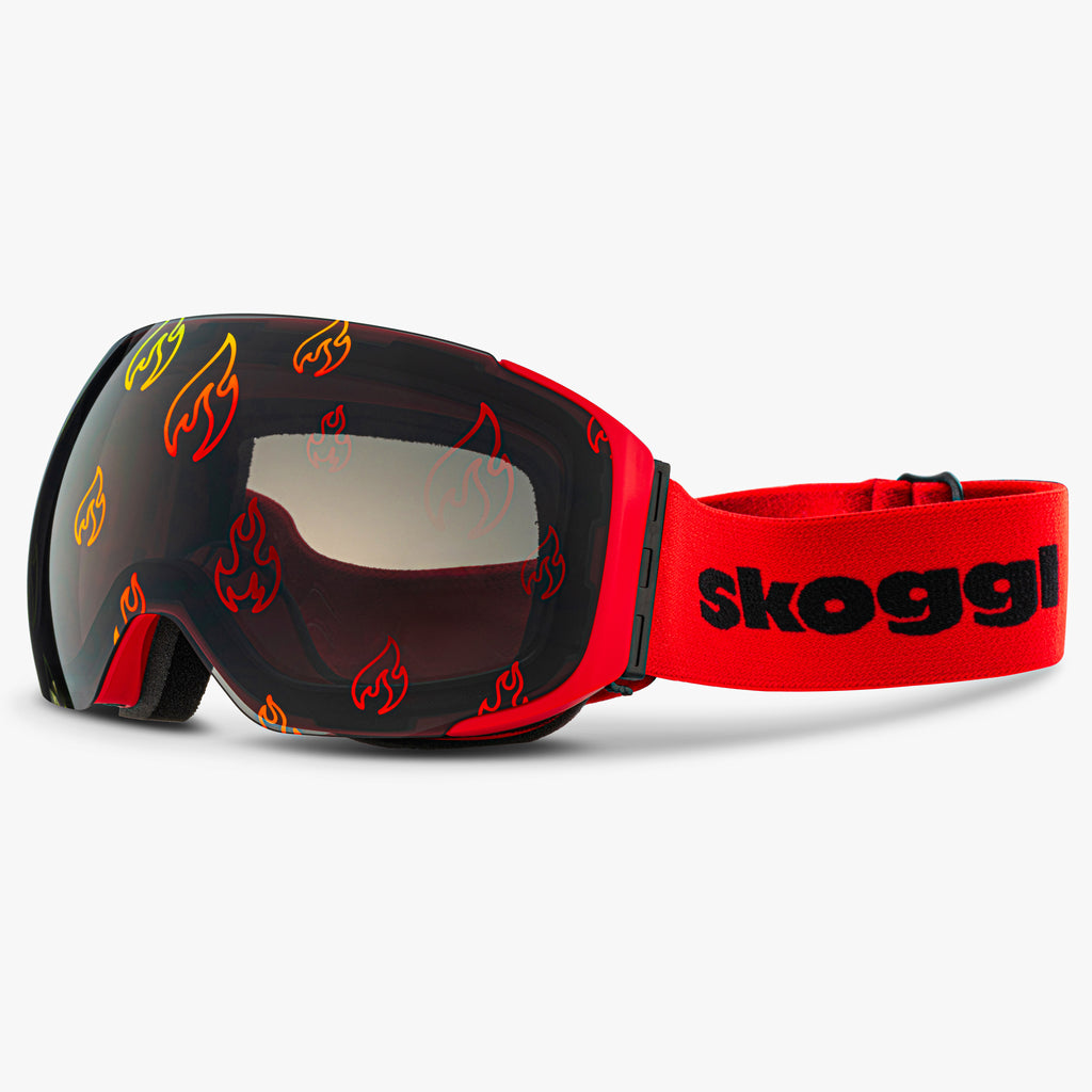 Skoggl Flare Vision ski goggles with magnetic flame-printed lens and red strap – custom snow goggles with anti-fog, UV400 protection, and bold interchangeable design.