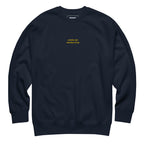 Navy Skoggl Après Ski Instructor sweatshirt with yellow embroidered chest text, fleece-lined for warmth.