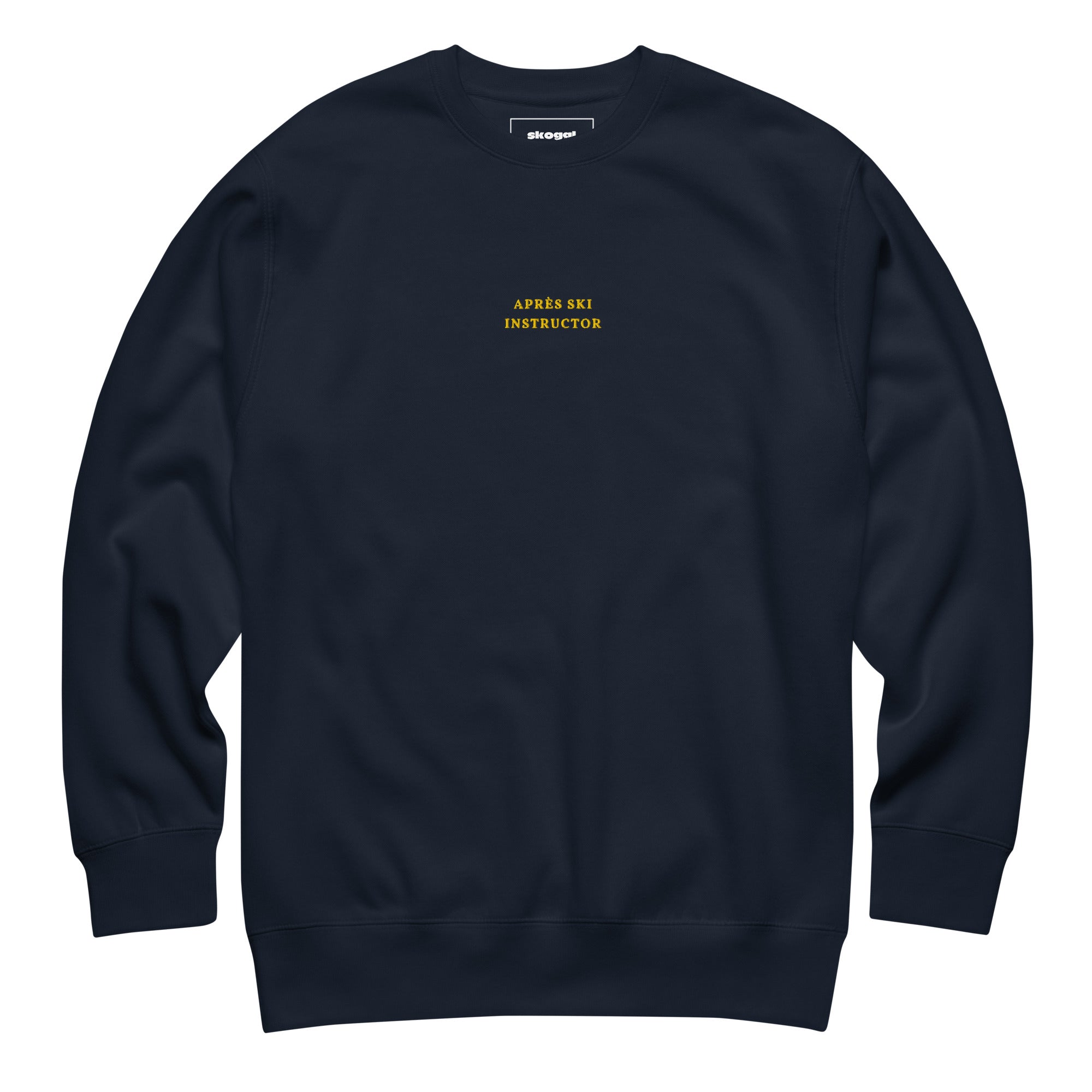 Navy Skoggl Après Ski Instructor sweatshirt with yellow embroidered chest text, fleece-lined for warmth.