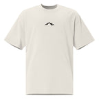 Front view of Skoggl Original heavyweight oversized t-shirt in Washed Oat, featuring a black mountain logo on the chest and a drop-shoulder fit.