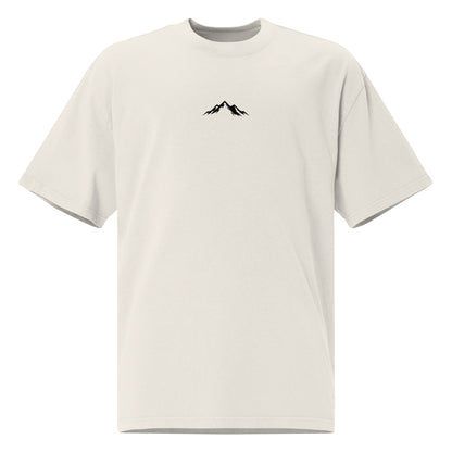 Front view of Skoggl Original heavyweight oversized t-shirt in Washed Oat, featuring a black mountain logo on the chest and a drop-shoulder fit.