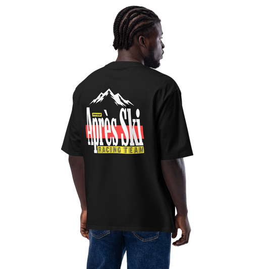 Back view of model wearing oversized Skoggl Après Ski Racing Team black t-shirt with mountain graphic and bold retro print
