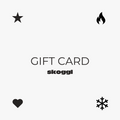 A gift card for Skoggl ski and snowboard goggles, featuring a clean and modern design. In each corner of the card, there are small icons representing Skoggl's lens designs: a heart, a star, a snowflake, and a fire symbol. 