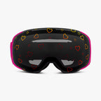 Front view of Skoggl Lovefrost ski and snowboard goggles with hearts on the lens, featuring a pink frame, pink strap, and sunny skies lens. The playful heart design combines style and performance, making these goggles perfect for skiing, snowboarding, and winter sports.
