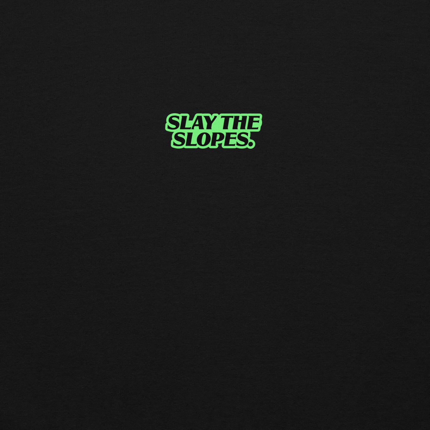 Skoggl black hoodie featuring green ‘SLAY THE SLOPES’ text, cozy crew neck sweatshirt for winter slopes and après-ski.