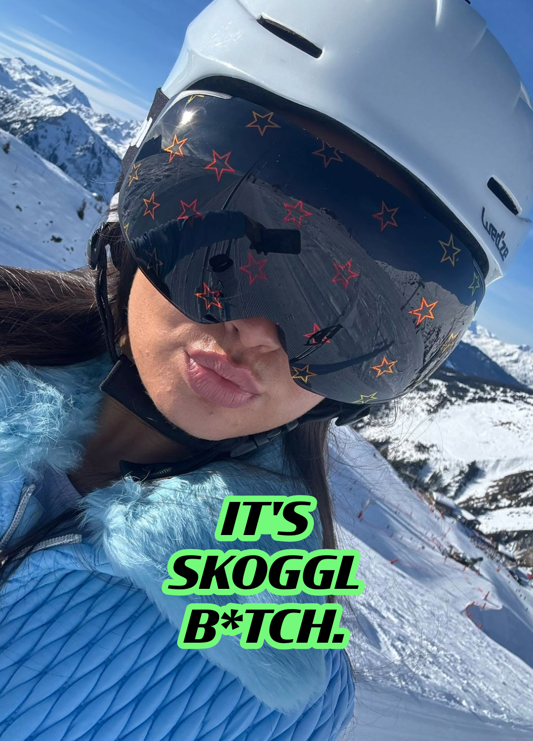 Skoggl star-pattern ski goggles white helmet snowy mountain