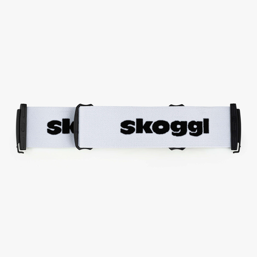 A pure white strap designed for ski and snowboard goggles, featuring durable material and easy attachment for a secure, customizable fit. Perfect for pairing with Skoggl frames to add a pop of color and style to your winter sports gear.