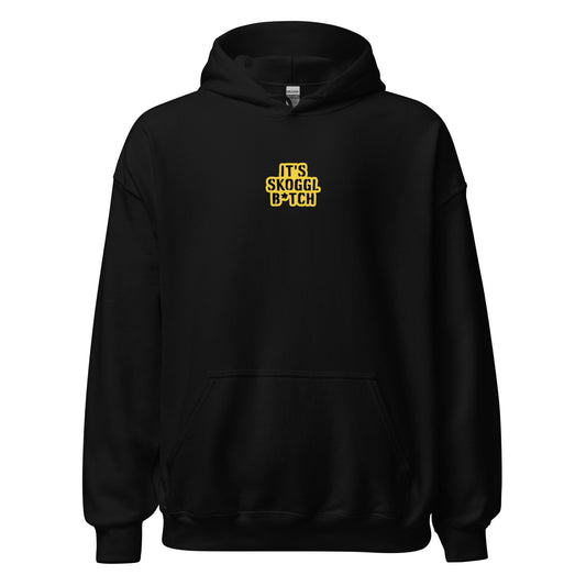 Black hoodie with yellow text reading ‘It’s Skoggl B*tch’ on the front, facing right, displayed on a white background.