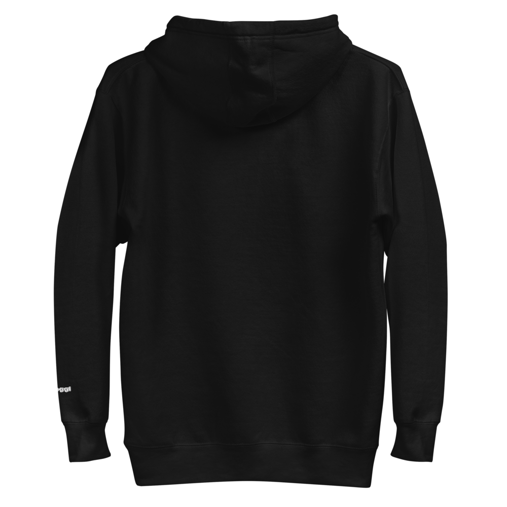 A plain black hooded sweatshirt shown from the back, with a small white text detail on the lower right sleeve near the cuff. The detail reads "skoggl".