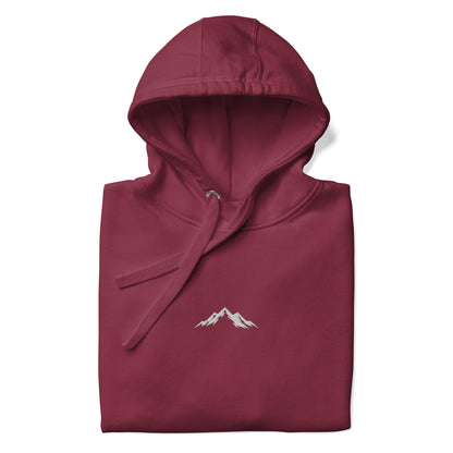 Maroon hoodie with a mountain logo on a white background